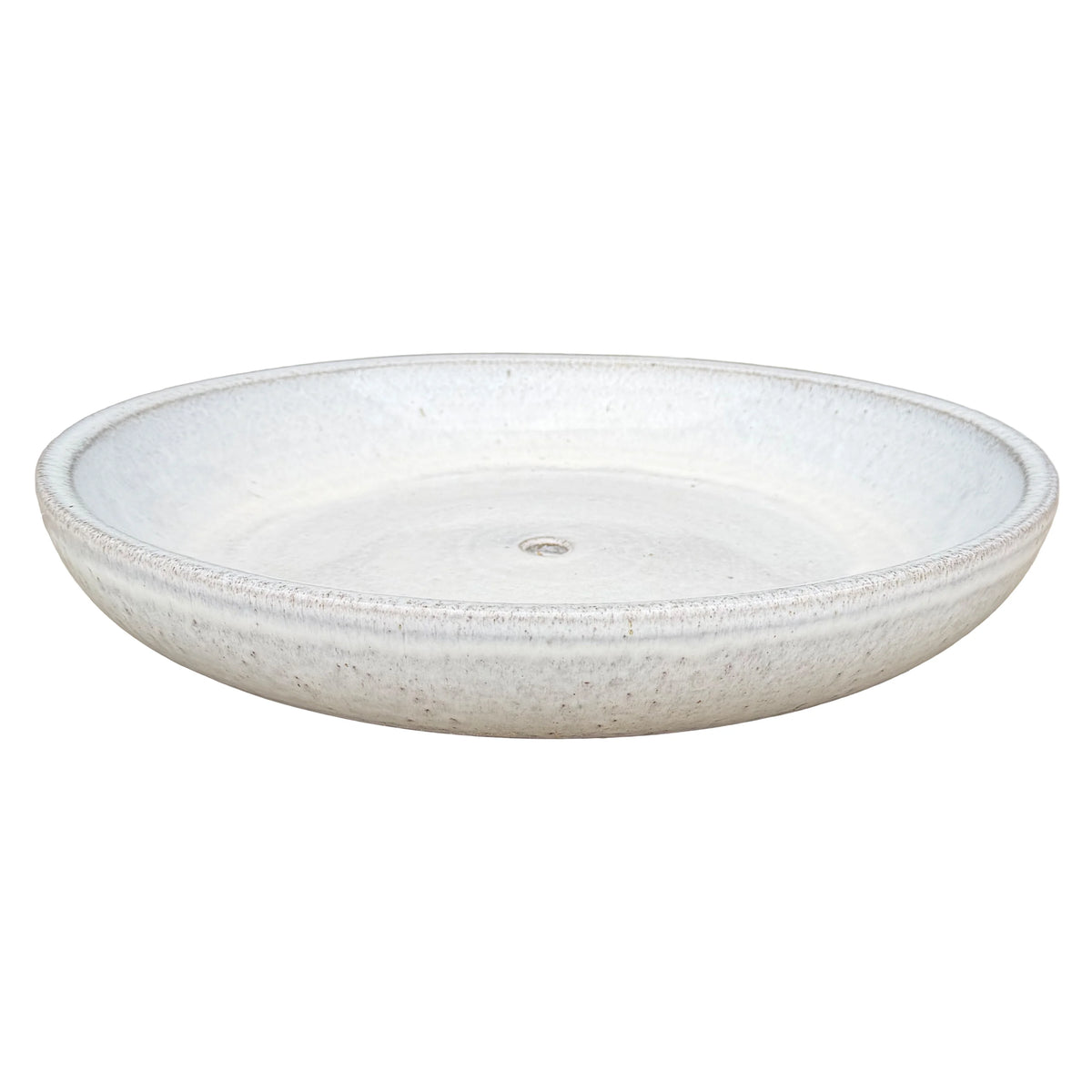 White ceramic succulent bowl viewed at an angle, showing a shallow speckled glaze interior, rounded rim and central drainage hole