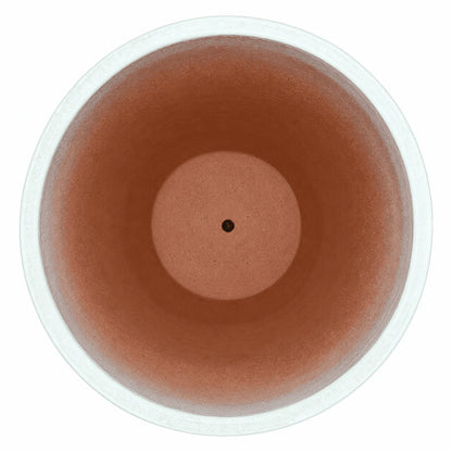 Top-down view of a white tapered ceramic egg planter, with a white rim and pale speckled inner walls that fade into a terracotta interior with a raised centre and small drainage hole