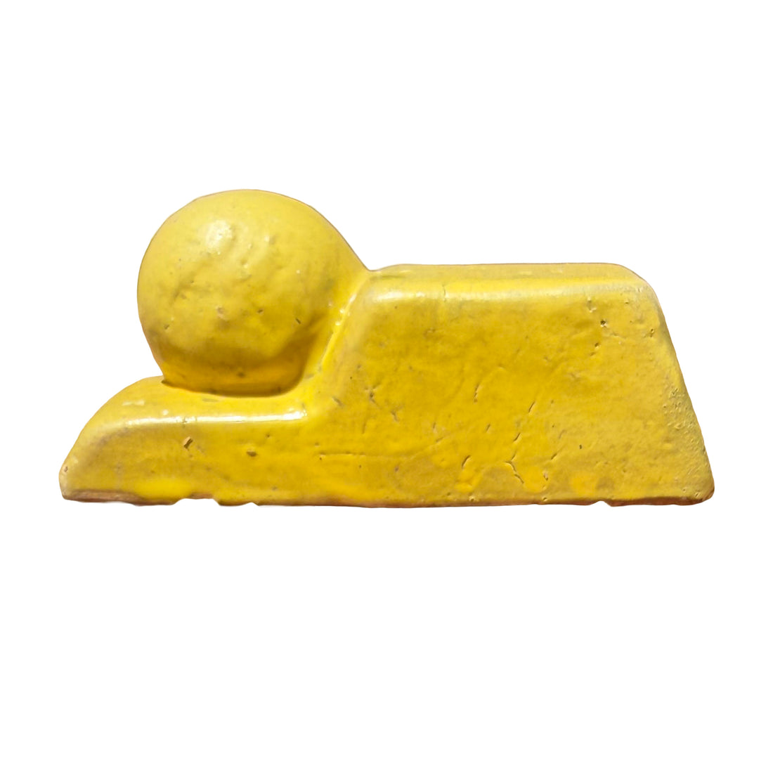 Side profile of a yellow glazed pot feet, with a raised block section beside a lower ledge holding a round ball.