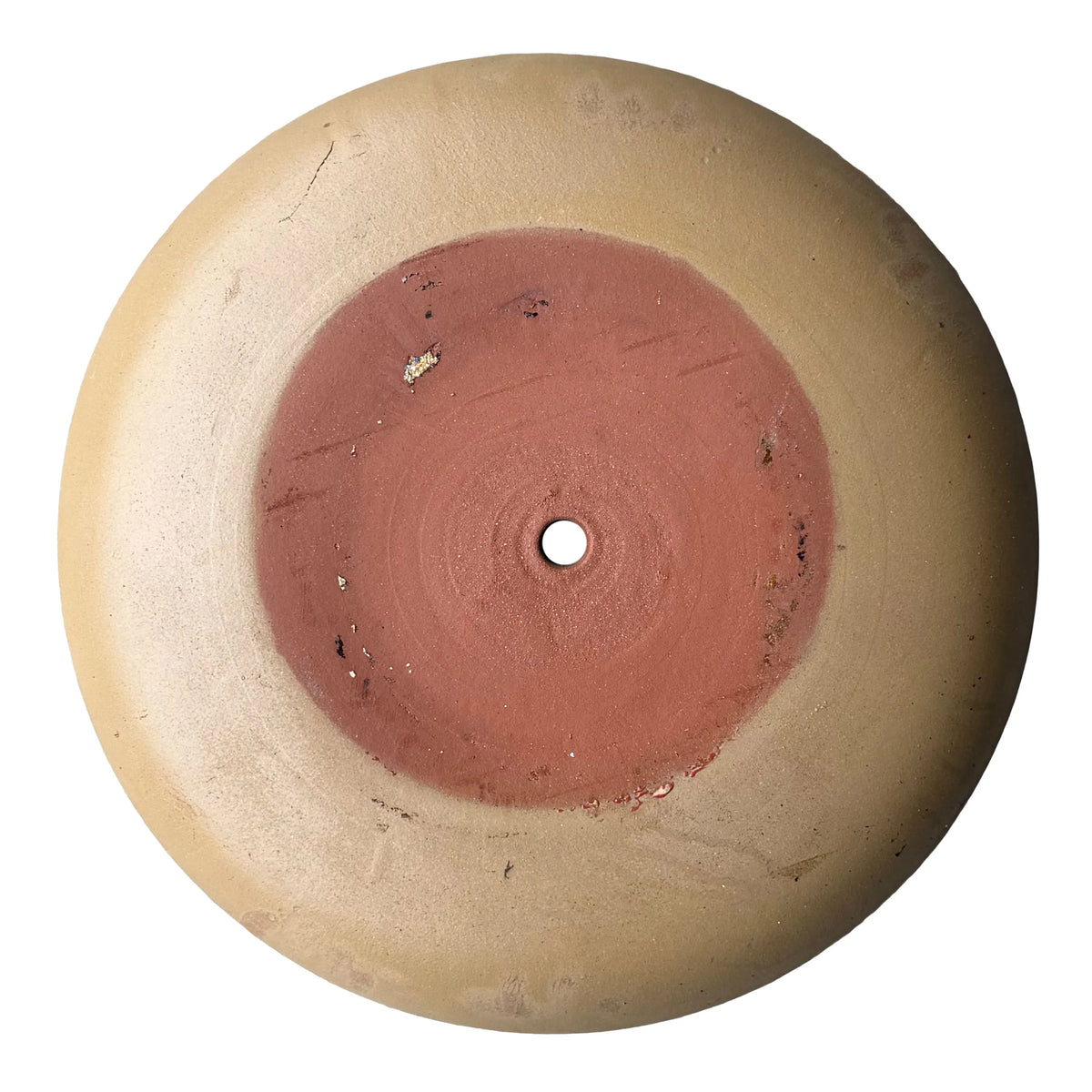 Top-down view inside a yellow spray ceramic succulent bowl, with a soft mustard-yellow satin finish, faint throwing rings and a single drainage hole in the center