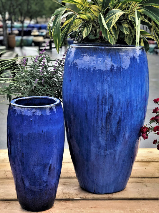 Image of 2 blue slender round pots.