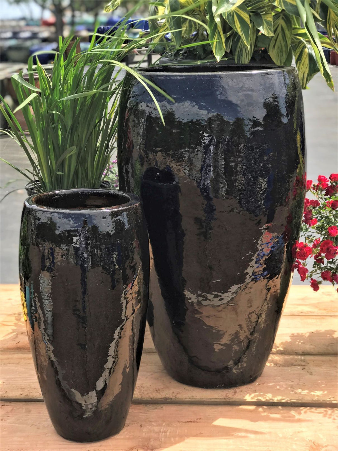 Image of 2 black slender round pots.