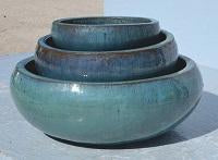 Image of three blue shallow rice bowls stacked